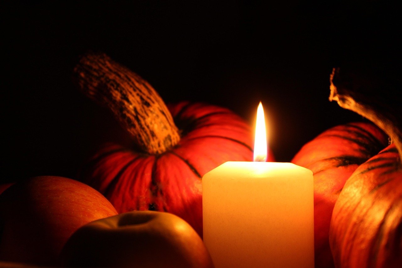 Halloween decor color palette ideas with pumpkins and candles