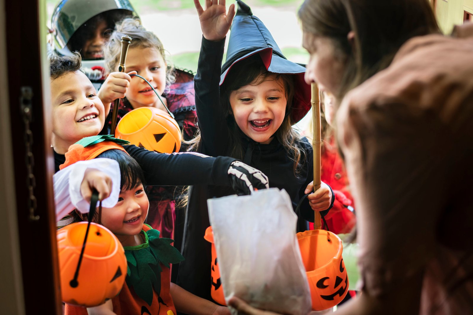 Kids trick or treating in Halloween costumes